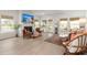 Cozy living room with fireplace, ample seating and natural light throughout at 1150 Cooper Point St, Summerville, SC 29485