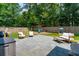 Large backyard featuring a stone patio, outdoor seating, and a playset for Gathering fun at 1164 Sharpestowne Ct, Mount Pleasant, SC 29466