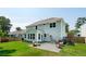 Spacious backyard features a stone patio, outdoor seating, and well-maintained landscaping at 1164 Sharpestowne Ct, Mount Pleasant, SC 29466