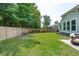 Expansive backyard with lush lawn, wooden fence, and ample space for recreation and relaxation at 1164 Sharpestowne Ct, Mount Pleasant, SC 29466