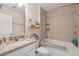 Bathroom featuring a granite vanity, a toilet, and a tiled shower-tub combination with built-in shelves at 1164 Sharpestowne Ct, Mount Pleasant, SC 29466