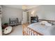 Light-filled bedroom featuring a decorative light fixture, a cozy chair, and baby changing table at 1164 Sharpestowne Ct, Mount Pleasant, SC 29466
