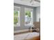 Bright bedroom features two large windows, a plush rug, and view of the neighboring houses at 1164 Sharpestowne Ct, Mount Pleasant, SC 29466