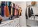 Walk-in closet features built-in shelving, drawers, and ample storage space for clothes and accessories at 1164 Sharpestowne Ct, Mount Pleasant, SC 29466