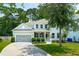 Charming two-story home with a gray exterior, inviting front porch, and manicured landscaping at 1164 Sharpestowne Ct, Mount Pleasant, SC 29466