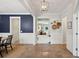 Open hallway featuring hardwood floors, decorative accents, and a charming Dutch door at 1164 Sharpestowne Ct, Mount Pleasant, SC 29466