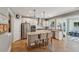 Well-lit kitchen with granite countertops, a stainless steel refrigerator, and a central island with seating at 1164 Sharpestowne Ct, Mount Pleasant, SC 29466