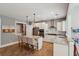 Bright kitchen with granite countertops, stainless steel appliances, and an island with bar stool seating at 1164 Sharpestowne Ct, Mount Pleasant, SC 29466