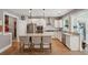 Well-lit kitchen with granite countertops, stainless steel appliances, and a central island with seating at 1164 Sharpestowne Ct, Mount Pleasant, SC 29466