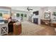 Cozy living room with a fireplace, large windows, and comfortable seating area at 1164 Sharpestowne Ct, Mount Pleasant, SC 29466