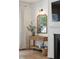 Living room with a fireplace, wooden floors, decorative mirror, and a cozy atmosphere at 1164 Sharpestowne Ct, Mount Pleasant, SC 29466
