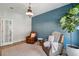 Comfortable living room with two leather chairs, side table, indoor plants, and plenty of natural light at 1164 Sharpestowne Ct, Mount Pleasant, SC 29466