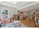 Spacious playroom featuring a play kitchen, dollhouse, wood flooring, and decorative rug at 1164 Sharpestowne Ct, Mount Pleasant, SC 29466