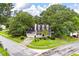 An aerial view shows the home with mature trees, front yard landscaping, and a two-car garage at 117 Berringer Dr, Goose Creek, SC 29445