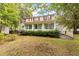 Back of the home with screened in porch, well-maintained lawn, and mature landscaping at 117 Berringer Dr, Goose Creek, SC 29445