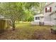 Backyard featuring mature trees, lawn, picket fence, and room for entertaining at 117 Berringer Dr, Goose Creek, SC 29445
