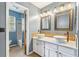 Bathroom featuring double vanity, decorative mirrors, and shower with modern fixtures at 117 Berringer Dr, Goose Creek, SC 29445