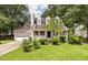 Charming two-story home with red shutters and a landscaped front yard and an attached two car garage at 117 Berringer Dr, Goose Creek, SC 29445