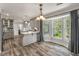 The spacious kitchen has modern cabinets and a breakfast nook with lots of natural light at 117 Berringer Dr, Goose Creek, SC 29445