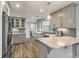 Modern kitchen with grey cabinets, marble countertops, breakfast bar, and stainless steel appliances at 117 Berringer Dr, Goose Creek, SC 29445