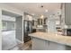 Modern kitchen with grey cabinets, marble countertops, breakfast bar, and stainless steel appliances at 117 Berringer Dr, Goose Creek, SC 29445