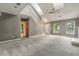 Bright, spacious living room with a fireplace, vaulted ceilings, and open stairway at 117 Berringer Dr, Goose Creek, SC 29445