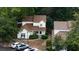 Overhead shot of the home with a brown roof, surrounded by lush green trees and a driveway with parked cars at 1211 Meadow Park Ln # B, Mount Pleasant, SC 29464