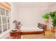 Bright bedroom with large window, wood floors, a bed, and decorative plants at 1211 Meadow Park Ln # B, Mount Pleasant, SC 29464