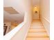 Bright staircase with wooden steps and white railings leading to the upper level at 1211 Meadow Park Ln # B, Mount Pleasant, SC 29464