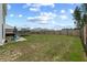 Fenced backyard with a trampoline, grill, patio furniture, and a large grassy area at 123 Lyra Ln, Summerville, SC 29486
