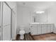 Bright bathroom featuring a shower with glass door, white vanity, and decorative rug at 123 Lyra Ln, Summerville, SC 29486