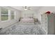 Bright bedroom featuring a decorative bed frame, plush rug, and natural light from windows at 123 Lyra Ln, Summerville, SC 29486