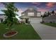 Charming two-story home features a well-manicured lawn and a two-car garage at 123 Lyra Ln, Summerville, SC 29486