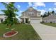 Charming two-story home features a well-manicured lawn and a two-car garage at 123 Lyra Ln, Summerville, SC 29486
