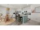 Eat-in kitchen boasting an island with bar stool seating and stainless steel appliances at 123 Lyra Ln, Summerville, SC 29486