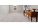 Empty living room space with neutral walls and flooring, plus a charming wooden console at 123 Lyra Ln, Summerville, SC 29486