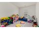 Playroom featuring colorful toy organizers, a play kitchen, and natural light at 123 Lyra Ln, Summerville, SC 29486