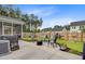 A backyard with a patio area, perfect for relaxing and enjoying the outdoors at 135 Cypress Preserve Blvd, Moncks Corner, SC 29461