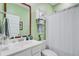 Well-lit bathroom featuring vanity, modern sink fixture, large mirror and cabinet with towel rack at 135 Cypress Preserve Blvd, Moncks Corner, SC 29461