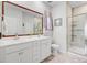 Bathroom with double sinks, a large mirror, tiled flooring, and a glass enclosed shower space at 135 Cypress Preserve Blvd, Moncks Corner, SC 29461