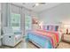 Inviting bedroom with comfortable seating, a bright window, and decorative pillows on the bed at 135 Cypress Preserve Blvd, Moncks Corner, SC 29461
