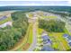 Panoramic shot of a neighborhood swimming pool with winding paths and a mix of homes and greenery at 135 Cypress Preserve Blvd, Moncks Corner, SC 29461