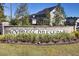 A landscaped sign at the entry of the Cypress Preserve community, set against a backdrop of neighborhood homes at 135 Cypress Preserve Blvd, Moncks Corner, SC 29461