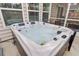 A hot tub on a porch outside with large windows for a relaxing evening at 135 Cypress Preserve Blvd, Moncks Corner, SC 29461