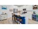 Modern kitchen featuring white cabinets, stainless steel appliances, and a blue island at 135 Cypress Preserve Blvd, Moncks Corner, SC 29461