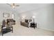 Comfortable living room features neutral carpet, cozy seating, ceiling fan and accent tables at 135 Cypress Preserve Blvd, Moncks Corner, SC 29461