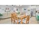 Open floorplan showing living, dining, and kitchen areas with ample natural light and hardwood floors at 135 Cypress Preserve Blvd, Moncks Corner, SC 29461