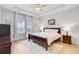 Serene bedroom with tray ceiling, natural light, and classic furnishings, creating a peaceful retreat at 135 Cypress Preserve Blvd, Moncks Corner, SC 29461