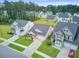 Picture of a neighborhood with lush lawns, sidewalks and various home styles, nestled in a tree lined community at 135 Cypress Preserve Blvd, Moncks Corner, SC 29461