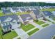 Aerial view of a suburban neighborhood showcasing well-manicured lawns and varied two-story home styles at 135 Cypress Preserve Blvd, Moncks Corner, SC 29461